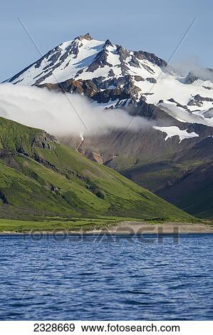 Frosty Volcano Near Cold Bay On The Alaska Peninsula In Summertime; Southwest Alaska, United States Of America View Large Photo Image Stock Photo - Frosty Volcano Near Cold Bay On The Alaska Peninsula In Summertime; Southwest Alaska, United States Of America. Fotosearch