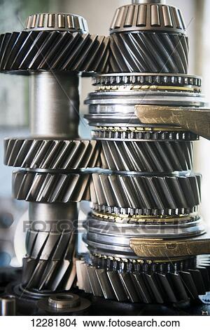 Picture - Gears waiting to be put into a broken down Land Rover; Zambia. Fotosearch