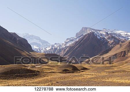 Stock Photo - High altitude valley leading to Mount Aconcagua in the distance; Mendoza, Argentina. Fotosearch