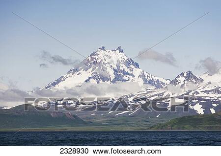 Stock Image - Isanotski Peaks, A Volcano On Unimak Island, The Easternmost Island Of The Aleutian Chain Is Locally Known As Ragged Jack; Alaska, United States Of America. Fotosearch