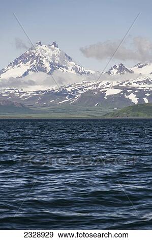 Stock Photo - Isanotski Peaks, A Volcano On Unimak Island, The Easternmost Island Of The Aleutian Chain Is Locally Known As Ragged Jack; Alaska, United States Of America. Fotosearch