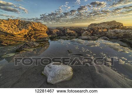 Late day light on the rocks of Marble Beach in Namakwaland National Park; South Africa View Large Photo Image Stock Photo - Late day light on the rocks of Marble Beach in Namakwaland National Park; South Africa. Fotosearch