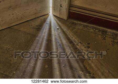 Lights shines from between a door and wall in interesting patterns in an old house; Kolmanskop, Namibia View Large Photo Image Stock Image - Lights shines from between a door and wall in interesting patterns in an old house; Kolmanskop, Namibia. Fotosearch