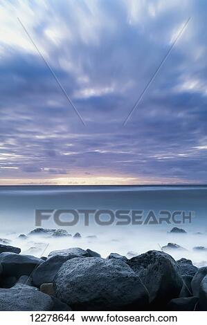 Picture - Long exposure of the surf along Wailua Beach; Wailua, Kauai, Hawaii, United States of America. Fotosearch
