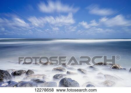 Long exposure of the surf along Wailua Beach; Wailua, Kauai, Hawaii, United States of America View Large Photo Image Stock Photo - Long exposure of the surf along Wailua Beach; Wailua, Kauai, Hawaii, United States of America. Fotosearch