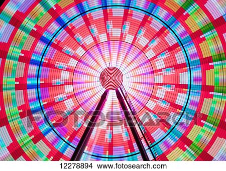 Long exposure photograph showcasing the many color combinations the Big Wheel produces at night; Seattle, Washington, United States of America View Large Photo Image Picture - Long exposure photograph showcasing the many color combinations the Big Wheel produces at night; Seattle, Washington, United States of America. Fotosearch