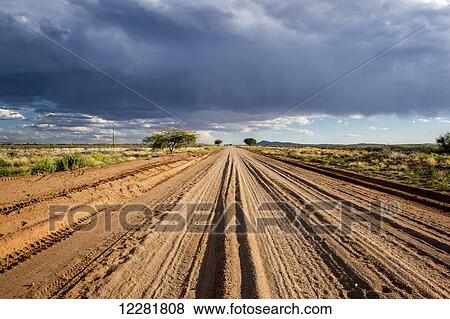 Looking down a dirt road in Africa; Namibia View Large Photo Image Stock Photo - Looking down a dirt road in Africa; Namibia. Fotosearch