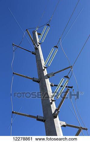 Low angle view of large metal hydro tower with glass insulators and blue sky; Alberta, Canada View Large Photo Image Stock Image - Low angle view of large metal hydro tower with glass insulators and blue sky; Alberta, Canada. Fotosearch