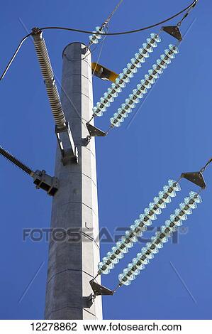 Low angle view of large metal hydro tower with glass insulators and blue sky; Alberta, Canada View Large Photo Image Stock Image - Low angle view of large metal hydro tower with glass insulators and blue sky; Alberta, Canada. Fotosearch