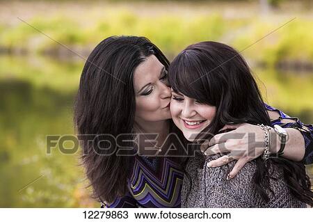 Stock Image - Mother and daughter spending quality time together outdoors in a city park in autumn; St. Albert, Alberta, Canada. Fotosearch
