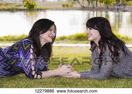 Mother and daughter spending quality time together outdoors in a city park in autumn; St. Albert, Alberta, Canada View Large Photo Image Stock Photograph - Mother and daughter spending quality time together outdoors in a city park in autumn; St. Albert, Alberta, Canada. Fotosearch