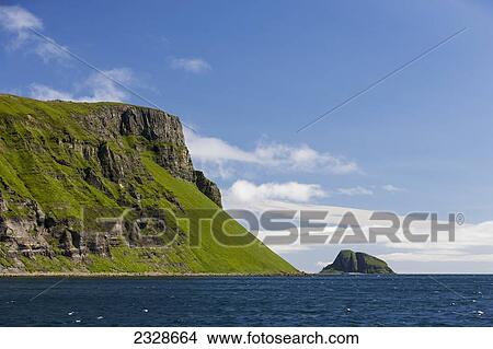 Picture - Palisade Cliffs And Sankin Island In Ikatan Bay; Southwest Alaska, United States Of America. Fotosearch