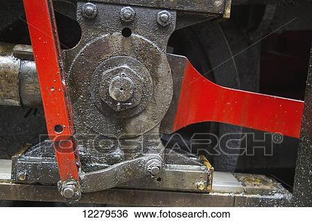 Stock Photograph - Part of machinery with red levers; Cumbria, England. Fotosearch