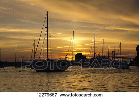 Stock Photo - Pleasure boats anchored in Naraganset Bay off Newport, Goat Island and bridge in background; Newport, Rhode Island, United States of America. Fotosearch