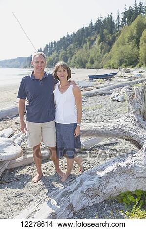 Portrait of a couple on a beach; Whidbey Island, Washington, United States of America View Large Photo Image Picture - Portrait of a couple on a beach; Whidbey Island, Washington, United States of America. Fotosearch