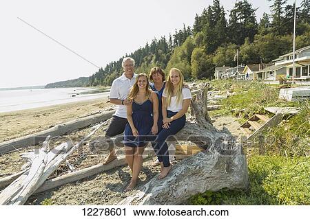 Portrait of a family on the beach; Whidbey Island, Washington, United States of America View Large Photo Image Stock Image - Portrait of a family on the beach; Whidbey Island, Washington, United States of America. Fotosearch