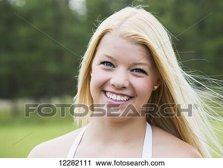 Portrait of a teenage girl with long blond hair; Edmonton, Alberta, Canada View Large Photo Image Stock Image - Portrait of a teenage girl with long blond hair; Edmonton, Alberta, Canada. Fotosearch