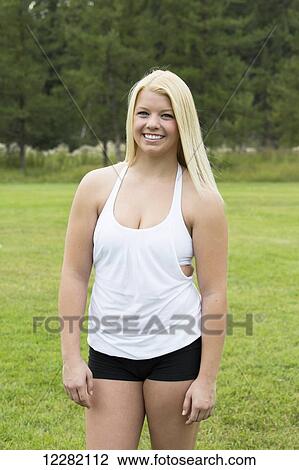 Stock Image - Portrait of a teenage girl with long blond hair; Edmonton, Alberta, Canada. Fotosearch