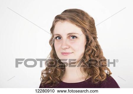 Portrait of a young woman with blond curly hair on a white background; Alberta, Canada View Large Photo Image Stock Image - Portrait of a young woman with blond curly hair on a white background; Alberta, Canada. Fotosearch