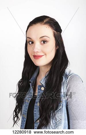 Portrait of a young woman with long dark hair on a white background; Alberta, Canada View Large Photo Image Stock Photo - Portrait of a young woman with long dark hair on a white background; Alberta, Canada. Fotosearch