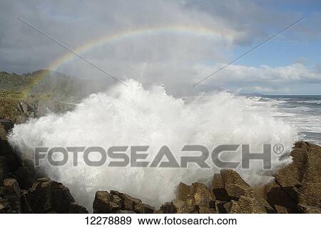 Punakaiki blowholes with a rainbow, West Coast of the South Island; New Zealand View Large Photo Image Stock Photo - Punakaiki blowholes with a rainbow, West Coast of the South Island; New Zealand. Fotosearch