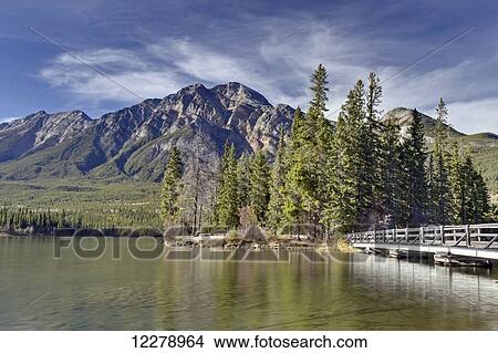 Pyramid Lake is kidney-shaped lake in Jasper National Park lying at the foot of Pyramid Mountain; Alberta, Canada View Large Photo Image Picture - Pyramid Lake is kidney-shaped lake in Jasper National Park lying at the foot of Pyramid Mountain; Alberta, Canada. Fotosearch