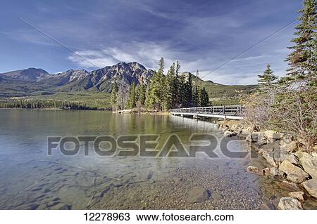 Pyramid Lake is kidney-shaped lake in Jasper National Park lying at the foot of Pyramid Mountain; Alberta, Canada View Large Photo Image Stock Image - Pyramid Lake is kidney-shaped lake in Jasper National Park lying at the foot of Pyramid Mountain; Alberta, Canada. Fotosearch