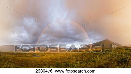 Stock Photograph - Rainbow In The Sky And Brooks Range, Gates Of The Arctic National Park, Northwestern Alaska; Alaska, United States Of America. Fotosearch