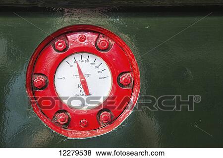 Stock Photo - Red gauge for a fuel tank; Cumbria, England. Fotosearch