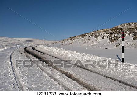 Stock Image - Roads high in the Yorkshire Dales in very wintery conditions; Yorkshire, England. Fotosearch