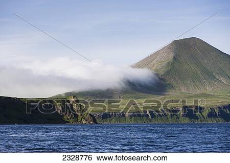Stock Photograph - Sentinel Peak On The Alaska Peninsula Near Its Westernmost Point; False Pass, Southwest Alaska, United States Of America. Fotosearch