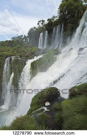Stock Image - Series of impressive waterfalls photographed from the side; Missiones, Argentina. Fotosearch