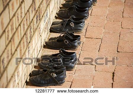 Shoes neatly organized in orphanage; Hammanskraal, Gautang, South Africa View Large Photo Image Stock Photo - Shoes neatly organized in orphanage; Hammanskraal, Gautang, South Africa. Fotosearch