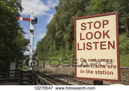 Sign of caution along train tracks; Ainthorpe, North Yorkshire, England View Large Photo Image Stock Photo - Sign of caution along train tracks; Ainthorpe, North Yorkshire, England. Fotosearch