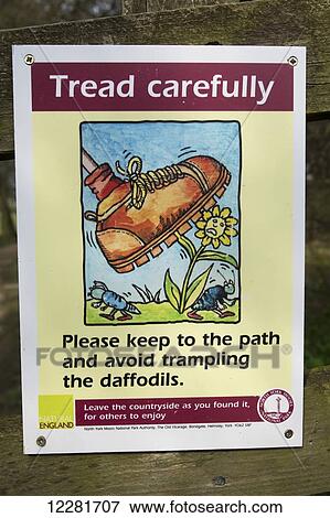 Stock Photo - Signs on gates asking walkers to keep gates shut and keep to the path; North York Moors, England. Fotosearch