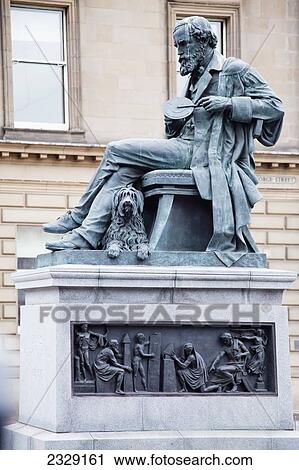 Stock Image - Statue Of A Man And His Dog On George Street; Edinburgh, Scotland. Fotosearch
