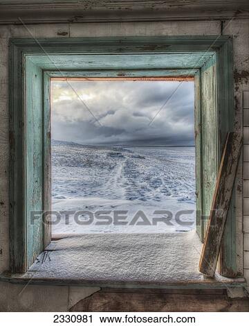 Stock Image - Stormy Skies Seen From A Window In An Abandoned House; Iceland. Fotosearch
