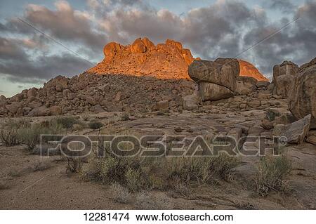 Picture - Sunrise light hitting the rocks in Richtersveld National Park; South Africa. Fotosearch