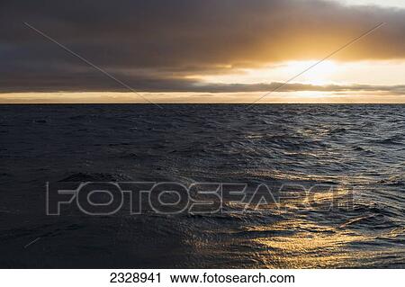 Stock Image - Sunrise Over The Pacific Ocean Near Unimak Island; Alaska, United States Of America. Fotosearch