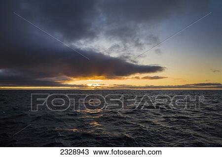 Sunrise Over The Pacific Ocean Near Unimak Island; Alaska, United States Of America View Large Photo Image Stock Image - Sunrise Over The Pacific Ocean Near Unimak Island; Alaska, United States Of America. Fotosearch
