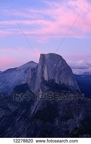 Stock Image - Sunset on Half Dome as seen from Glacier Point, Yosemite National Park; California, United States of America. Fotosearch