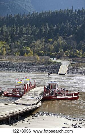 The Lytton cable ferry crossing the Fraser River, North of Lytton; British Columbia, Canada View Large Photo Image Stock Photograph - The Lytton cable ferry crossing the Fraser River, North of Lytton; British Columbia, Canada. Fotosearch