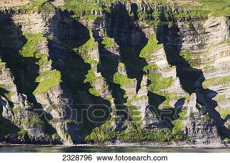 The Pallisade Cliffs In Ikatan Bay Of False Pass, Also Known As Isanotski Strait, In Summertime; Southwest Alaska, United States Of America View Large Photo Image Stock Photograph - The Pallisade Cliffs In Ikatan Bay Of False Pass, Also Known As Isanotski Strait, In Summertime; Southwest Alaska, United States Of America. Fotosearch