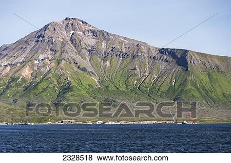 Stock Photo - The Town Of False Pass On Unimak Island, The First Of The Aleutian Island Chain; False Pass Southwest Alaska, United States Of America. Fotosearch