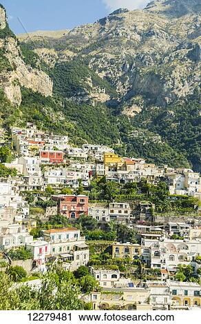 Stock Image - This mountainous view is one of the many historic villages built into the mountains that tourists see when driving the scenic highway Amalfi Coast of Italy; Amalfi, Province of Salerno, Italy. Fotosearch