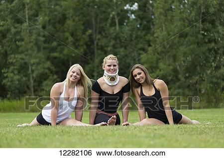 Three teenage gymnasts posing outdoors after practicing in a park; Edmonton, Alberta, Canada View Large Photo Image Stock Photograph - Three teenage gymnasts posing outdoors after practicing in a park; Edmonton, Alberta, Canada. Fotosearch