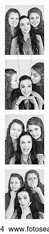 Picture - Three young women creating photo booth series of images in filmstrip format; Alberta, Canada. Fotosearch