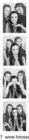 Stock Photo - Three young women creating photo booth series of images in filmstrip format; Alberta, Canada. Fotosearch
