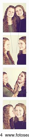 Two young women creating photo booth series of images in filmstrip format; Alberta, Canada View Large Photo Image Picture - Two young women creating photo booth series of images in filmstrip format; Alberta, Canada. Fotosearch