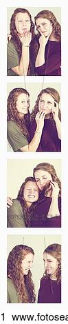 Two young women creating photo booth series of images in filmstrip format; Alberta, Canada View Large Photo Image Stock Image - Two young women creating photo booth series of images in filmstrip format; Alberta, Canada. Fotosearch